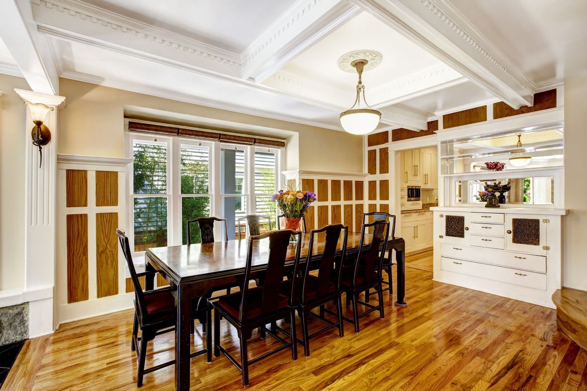 Dark, Oaken Dining Room Table with Hardwood Floors