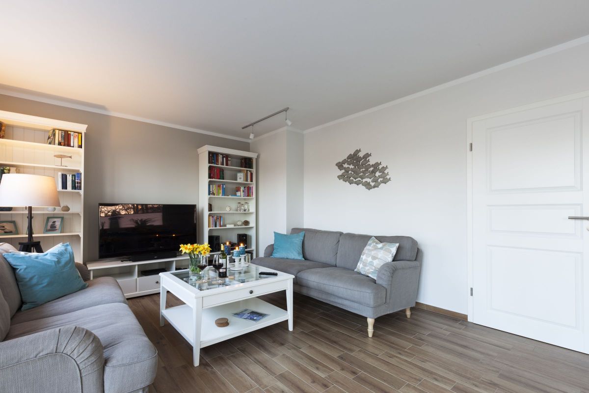 Tan Couches that Contrast with White Walls