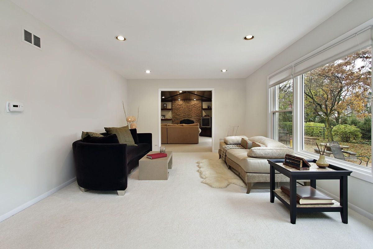 Starkly Contrasting Living Room to Dining Area