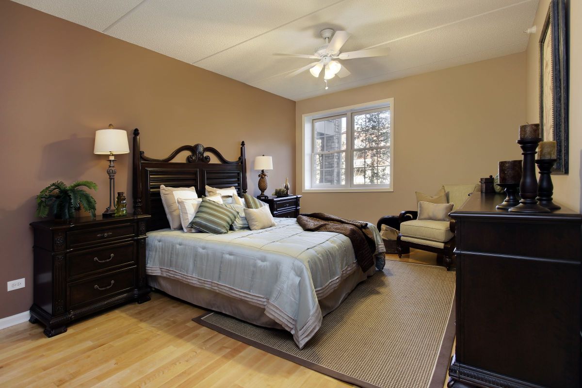 Deeply Dark Stained Wooden Furniture in a Bedroom