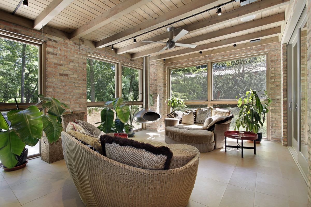 Relaxing sunroom with exposed beams