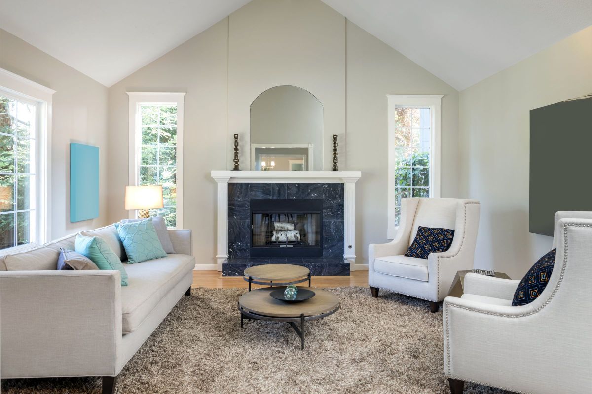 Matching Off White Couches, Walls, and Fireplace Mantle