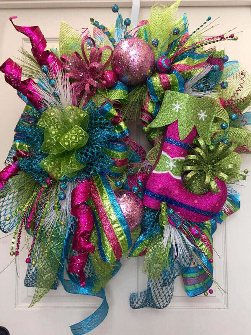 Festive holiday colors on an outdoor wreath