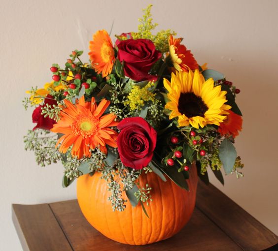 To create a beautiful bouquet for your table, all you need is a great vase (or pumpkin) and some fall-colored flowers.