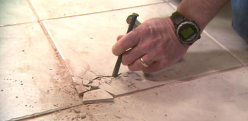 Repairing a cracked tile is something a handyman can help you with.